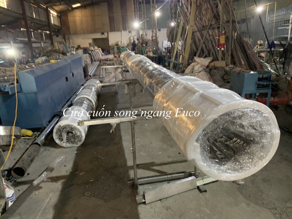 Nhà máy cửa cuốn song ngang ống tròn INOX phi 19